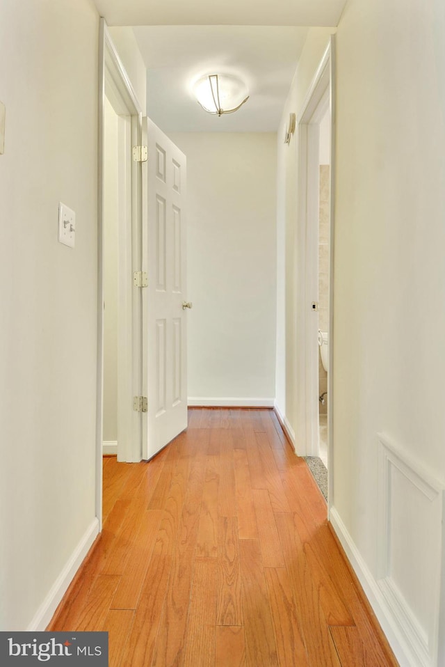 146 Monroe St Unit 101, Rockville, MD 20850 - hall featuring light wood-type flooring and baseboards