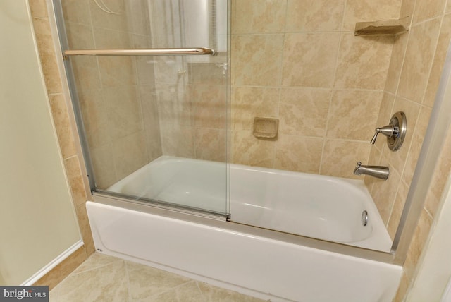 146 Monroe St Unit 101, Rockville, MD 20850 - bathroom with bath / shower combo with glass door, baseboards, and tile patterned floors