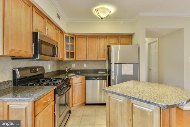 146 Monroe St Unit 101, Rockville, MD 20850 - kitchen featuring stainless steel appliances, a sink, tasteful backsplash, ornamental molding, and glass insert cabinets