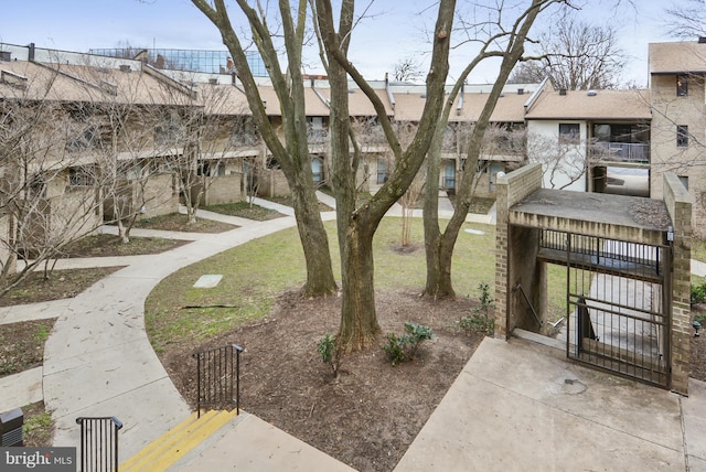 146 Monroe St Unit 101, Rockville, MD 20850 - view of property's community with a gate, fence, and a residential view