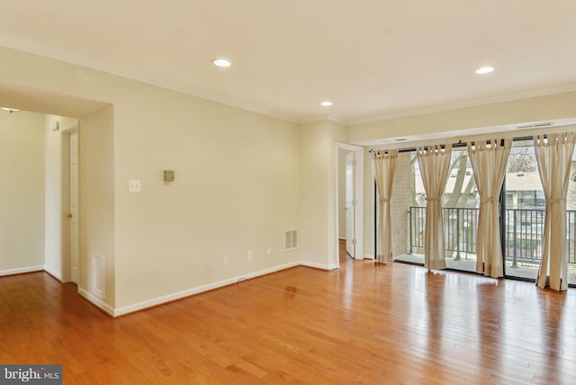 146 Monroe St Unit 101, Rockville, MD 20850 - empty room featuring baseboards, light wood-type flooring, crown molding, and recessed lighting