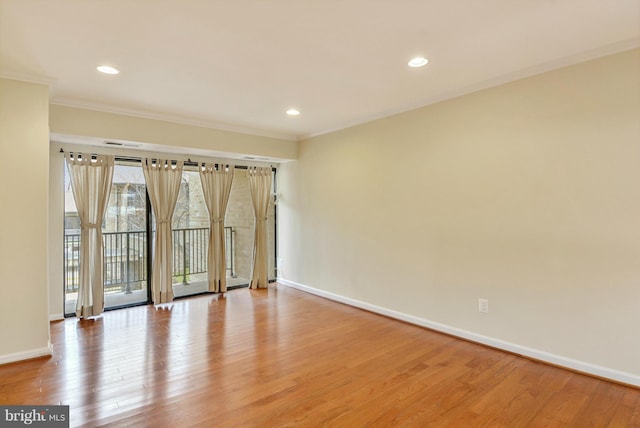 146 Monroe St Unit 101, Rockville, MD 20850 - unfurnished room with baseboards, light wood-type flooring, crown molding, and recessed lighting