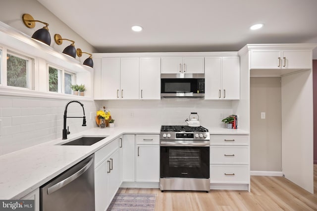 702 Lupin St, Browns Mills, NJ 08015 - kitchen with stainless steel appliances, a sink, white cabinetry, and recessed lighting