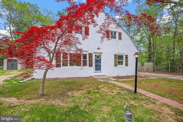 702 Lupin St, Browns Mills, NJ 08015 - view of front of home with an outdoor structure, a storage unit, and entry steps