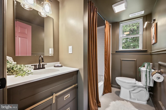702 Lupin St, Browns Mills, NJ 08015 - bathroom featuring toilet, vanity, tile patterned floors, and shower / bath combo with shower curtain