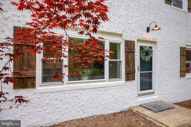 702 Lupin St, Browns Mills, NJ 08015 - view of exterior entry featuring stucco siding