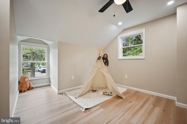 702 Lupin St, Browns Mills, NJ 08015 - playroom featuring ceiling fan, wood finished floors, lofted ceiling, healthy amount of natural light, and baseboards