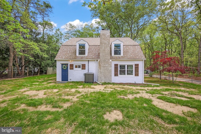 702 Lupin St, Browns Mills, NJ 08015 - back of house with a chimney, roof with shingles, and cooling unit