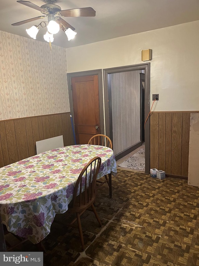 5721 N Lawrence St, Philadelphia, PA 19120 - bedroom with a wainscoted wall, wood walls, and a ceiling fan