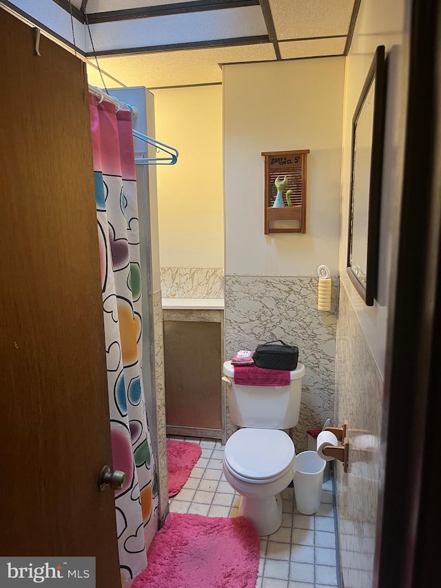 5721 N Lawrence St, Philadelphia, PA 19120 - bathroom with toilet, tile patterned flooring, and a shower with curtain