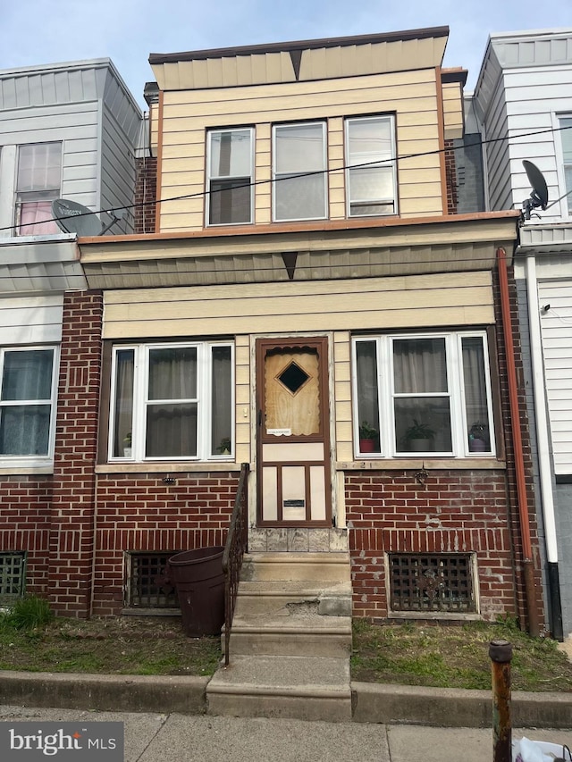 5721 N Lawrence St, Philadelphia, PA 19120 - townhome / multi-family property featuring entry steps and brick siding