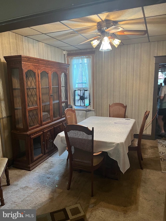 5721 N Lawrence St, Philadelphia, PA 19120 - carpeted dining room featuring a ceiling fan and wood walls