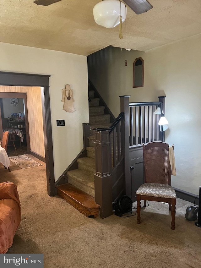5721 N Lawrence St, Philadelphia, PA 19120 - stairs with carpet floors, ceiling fan, a textured ceiling, and baseboards