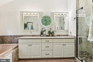 11050 Stonebrook Dr, Manassas, VA 20112 - full bath with a shower stall, double vanity, vaulted ceiling, and a bath