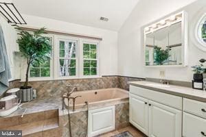 11050 Stonebrook Dr, Manassas, VA 20112 - full bathroom with lofted ceiling, healthy amount of natural light, vanity, and a bath