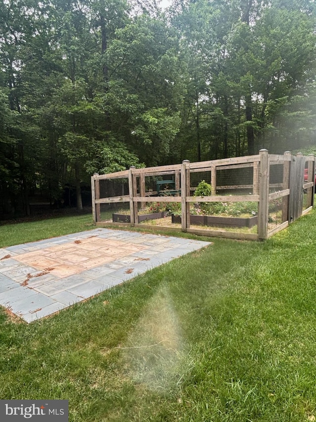 11050 Stonebrook Dr, Manassas, VA 20112 - view of yard with a gate and a vegetable garden