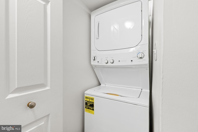 laundry room with stacked washer and clothes dryer