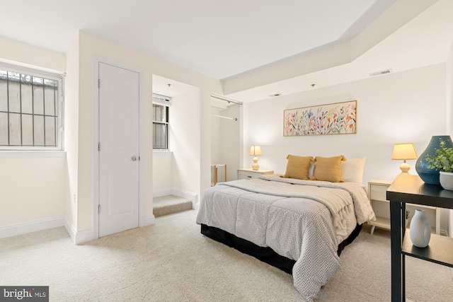 bedroom featuring carpet floors and baseboards
