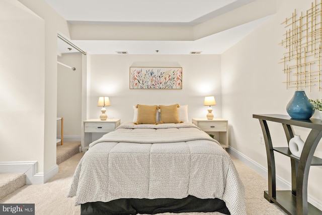 carpeted bedroom with baseboards