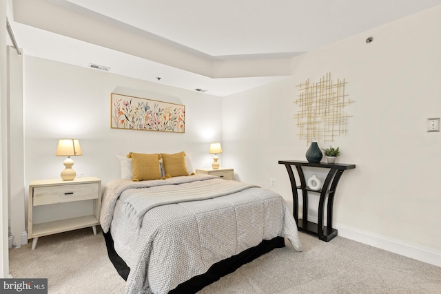 bedroom with carpet flooring and baseboards