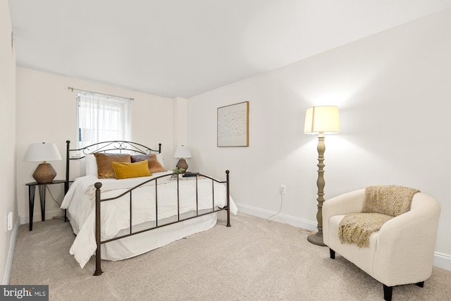bedroom featuring carpet floors and baseboards
