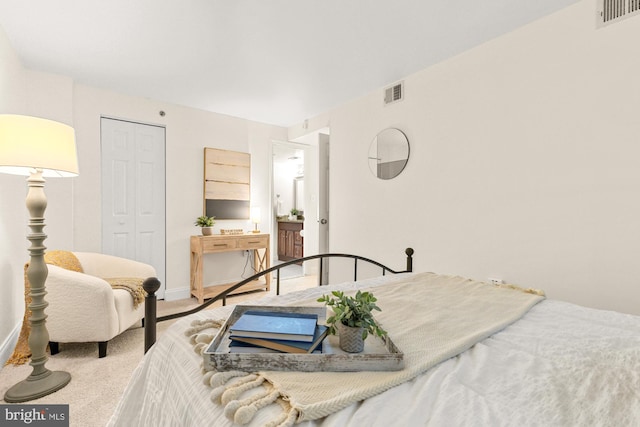 bedroom with a closet, carpet floors, and baseboards