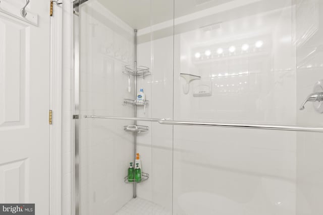 bathroom with a shower stall