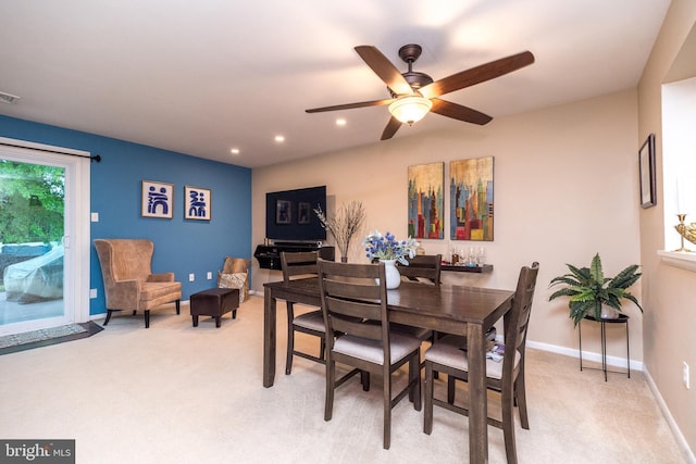 dining area featuring light colored carpet, recessed lighting, a ceiling fan, and baseboards