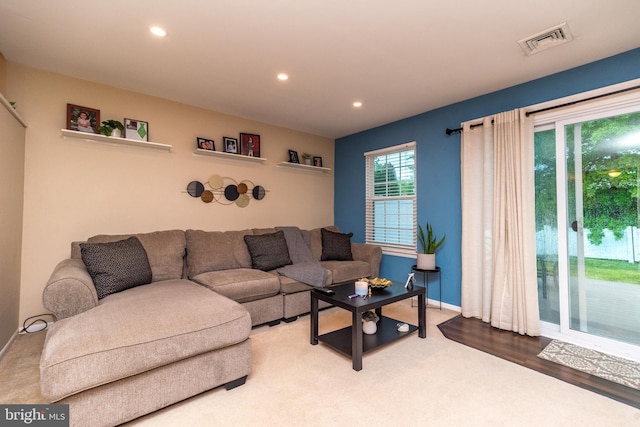 living room featuring recessed lighting and baseboards
