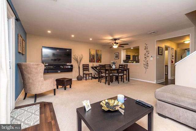 living area with baseboards, ceiling fan, carpet, and recessed lighting