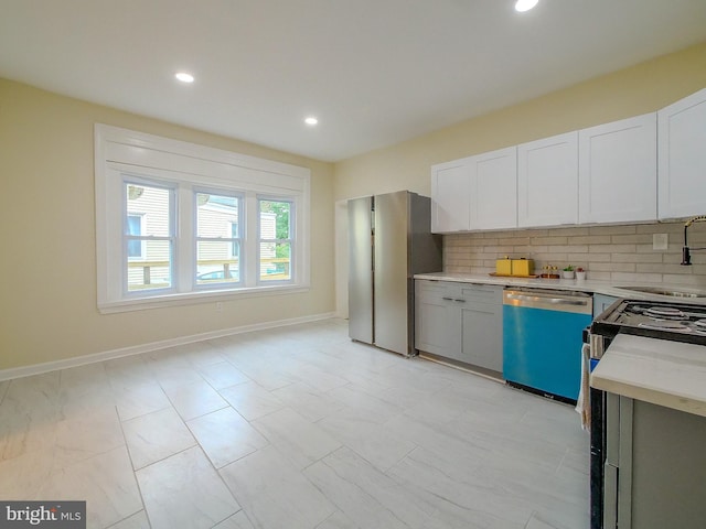 1008 Mcclenahan Ter, Marcus Hook, PA 19061 - kitchen with dishwashing machine, freestanding refrigerator, light countertops, a sink, and tasteful backsplash