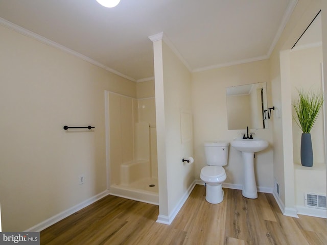 1008 Mcclenahan Ter, Marcus Hook, PA 19061 - full bath featuring wood finished floors, a stall shower, toilet, baseboards, and crown molding