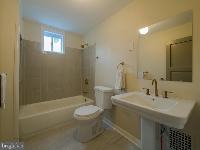 1008 Mcclenahan Ter, Marcus Hook, PA 19061 - bathroom featuring toilet, baseboards, tile patterned floors, shower / bathtub combination, and a sink