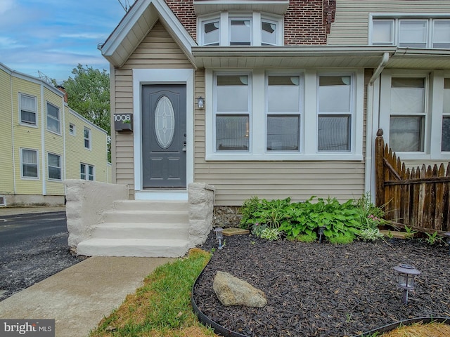 1008 Mcclenahan Ter, Marcus Hook, PA 19061 - view of exterior entry featuring fence