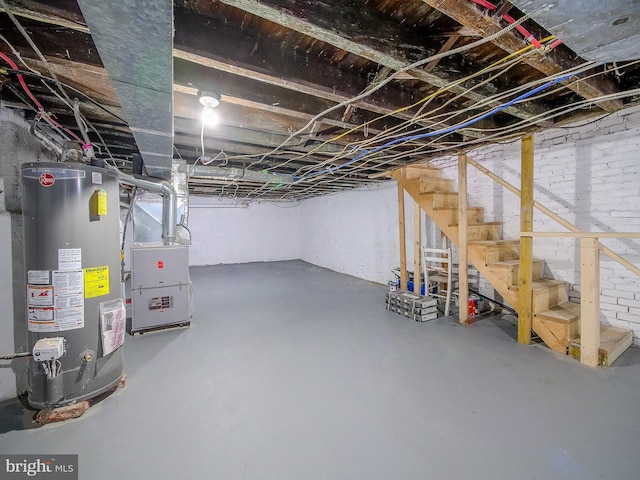 1008 Mcclenahan Ter, Marcus Hook, PA 19061 - unfinished basement with water heater, stairs, and heating unit