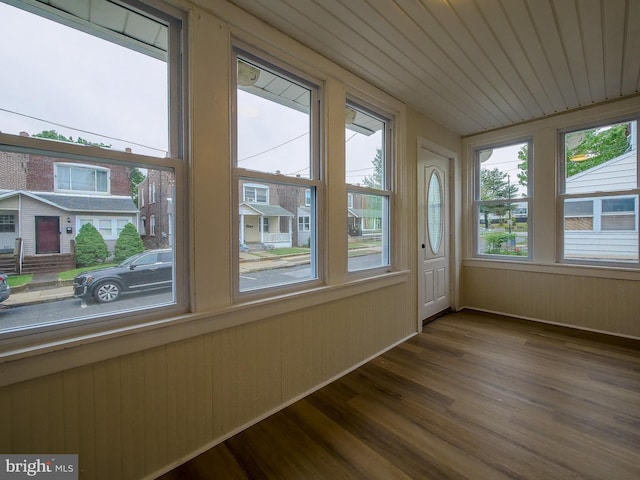 1008 Mcclenahan Ter, Marcus Hook, PA 19061 - unfurnished sunroom featuring healthy amount of natural light, wood finished floors, and wood walls