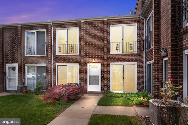 9001 Ridge Ave Unit 14, Philadelphia, PA 19128 - view of property featuring brick siding and central AC unit