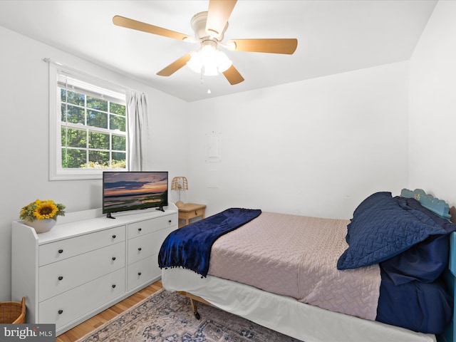 bedroom featuring light wood-style floors and a ceiling fan
