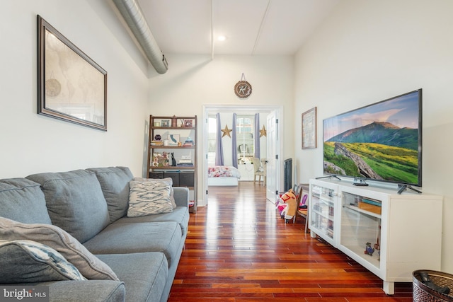 living room featuring dark wood finished floors and recessed lighting