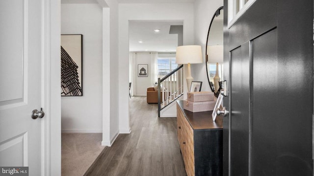 foyer entrance featuring baseboards, stairway, dark wood-style flooring, and recessed lighting