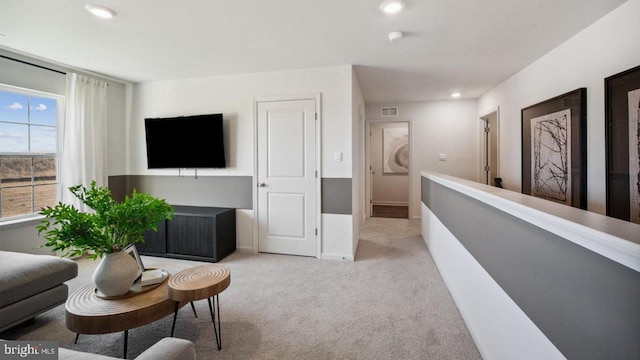 sitting room with carpet flooring, recessed lighting, and baseboards
