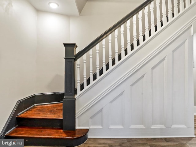 stairway with wood finished floors