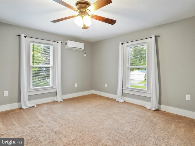 unfurnished room featuring an AC wall unit, healthy amount of natural light, and carpet flooring