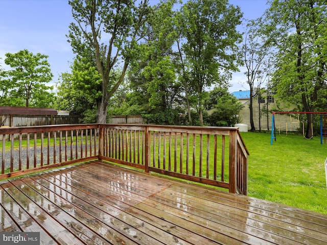 wooden terrace with a playground