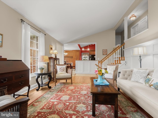 101 Gothard Rd, Lutherville Timonium, MD 21093 - living area with lofted ceiling, wood finished floors, and stairway