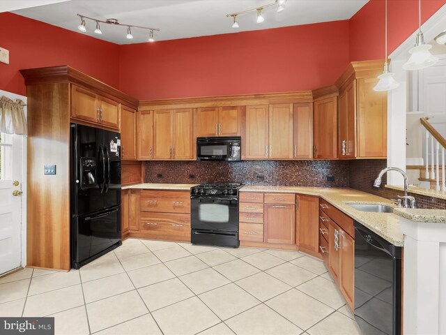 101 Gothard Rd, Lutherville Timonium, MD 21093 - kitchen featuring black appliances, a sink, track lighting, light tile patterned flooring, and decorative backsplash