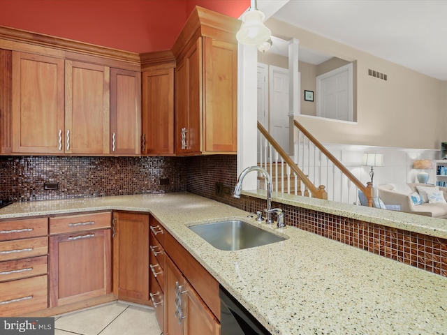 101 Gothard Rd, Lutherville Timonium, MD 21093 - kitchen featuring a sink, light stone countertops, and backsplash