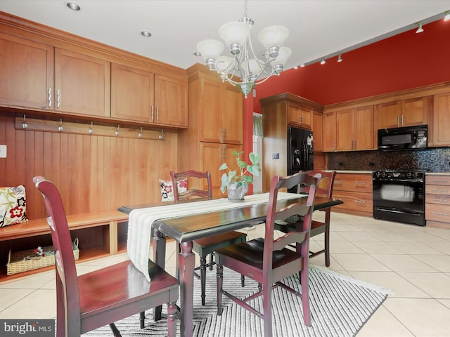 101 Gothard Rd, Lutherville Timonium, MD 21093 - dining space with track lighting, light tile patterned floors, and a chandelier