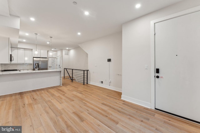 1645 W Virginia NE Unit 1, Washington, DC 20002 - unfurnished living room featuring recessed lighting, light wood finished floors, and baseboards