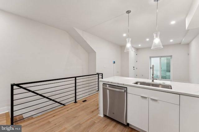 1645 W Virginia NE Unit 1, Washington, DC 20002 - kitchen with dishwasher, a sink, light wood-style flooring, white cabinetry, and light countertops